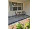Covered patio featuring a seating area with a table and chairs at 527 San Pedro Dr, The Villages, FL 32159