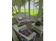 Relaxing sunroom with wicker furniture and views of the backyard at 527 San Pedro Dr, The Villages, FL 32159