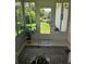 Bright sunroom with a view of the well-maintained backyard at 527 San Pedro Dr, The Villages, FL 32159
