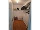 Walk-in closet featuring hardwood floors and wire rack shelving for storage at 527 San Pedro Dr, The Villages, FL 32159