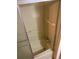 Clean, enclosed shower with glass door and molded shelving in a bathroom at 804 Maple Ln, Lady Lake, FL 32159