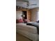 Bedroom featuring a ceiling fan, and an attached wardrobe cabinet, with soft lighting at 804 Maple Ln, Lady Lake, FL 32159
