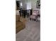 Inviting dining area with neutral carpet, a table set for four, and stylish accent furniture at 804 Maple Ln, Lady Lake, FL 32159