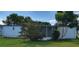 Charming single-story home with well-maintained lawn and some mature trees at 804 Maple Ln, Lady Lake, FL 32159
