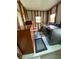 Utility room area with modern washer and dryer units and a wooden dresser at 804 Maple Ln, Lady Lake, FL 32159