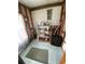 Small storage area with shelving, essential supplies, and natural light at 804 Maple Ln, Lady Lake, FL 32159