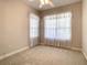 Spacious bedroom with window, carpet flooring, and ceiling fan at 235 Anastasia Dr, Poinciana, FL 34759