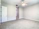 Primary bedroom with ceiling fan and access to bathroom at 235 Anastasia Dr, Poinciana, FL 34759