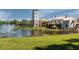 Community clubhouse with lakefront views and fountain at 235 Anastasia Dr, Poinciana, FL 34759