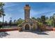 Stone fireplace in community courtyard with brick paving and landscaping at 235 Anastasia Dr, Poinciana, FL 34759