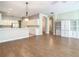 Open concept dining room with hardwood floors and chandelier at 235 Anastasia Dr, Poinciana, FL 34759