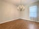 Formal dining room featuring hardwood floors and chandelier at 235 Anastasia Dr, Poinciana, FL 34759