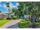 One-story home with manicured landscaping and driveway at 235 Anastasia Dr, Poinciana, FL 34759