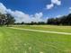 Scenic view of a lush green golf course at 235 Anastasia Dr, Poinciana, FL 34759