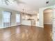 Open concept kitchen and dining area with hardwood floors at 235 Anastasia Dr, Poinciana, FL 34759