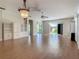 Living room with hardwood floors and built-in shelving at 235 Anastasia Dr, Poinciana, FL 34759