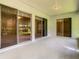 Screened porch with sliding glass doors at 235 Anastasia Dr, Poinciana, FL 34759