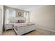 Bedroom with king-size bed and neutral decor at 5144 Oakbourne Ave, Davenport, FL 33837