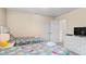 Bright bedroom with two twin beds, ample closet space and TV at 5144 Oakbourne Ave, Davenport, FL 33837