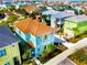 Aerial view of a colorful two-story house in a community at 2968 Salted Rim Rd, Kissimmee, FL 34747