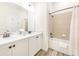 Bathroom with double vanity and shower/tub combo at 2968 Salted Rim Rd, Kissimmee, FL 34747