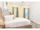 Bedroom with king-size bed and soft color palette at 2968 Salted Rim Rd, Kissimmee, FL 34747