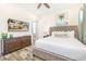 Bedroom with king-size bed and dresser at 2968 Salted Rim Rd, Kissimmee, FL 34747