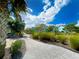 Paved walkway winds through a landscaped community at 2968 Salted Rim Rd, Kissimmee, FL 34747