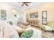 Living room with L-shaped sofa, TV, and decorative wooden cabinet at 2968 Salted Rim Rd, Kissimmee, FL 34747