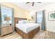 Main bedroom with king-size bed and ceiling fan at 2968 Salted Rim Rd, Kissimmee, FL 34747