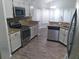 Kitchen with granite countertops and stainless steel appliances at 2863 Picadilly Cir, Kissimmee, FL 34747