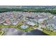 Community overview showcasing homes, pool, and lake at 7401 Levee Ln, Celebration, FL 34747