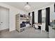 bedroom with a bunk bed, desk, and plenty of storage at 7401 Levee Ln, Celebration, FL 34747