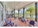 Relaxing community patio with lake view and comfortable seating at 7401 Levee Ln, Celebration, FL 34747