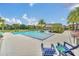 Inviting community pool with lounge chairs and patio seating at 7401 Levee Ln, Celebration, FL 34747