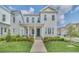 Two-story home with front porch and landscaping at 7401 Levee Ln, Celebration, FL 34747