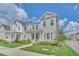 Two-story Craftsman home with front porch and landscaped lawn at 7401 Levee Ln, Celebration, FL 34747