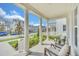 Spacious front porch with columns and street view at 7401 Levee Ln, Celebration, FL 34747