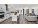 Modern kitchen with island, stainless steel appliances, and gray cabinets at 7401 Levee Ln, Celebration, FL 34747
