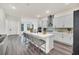 Open concept kitchen with white cabinets and island at 7401 Levee Ln, Celebration, FL 34747