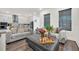 Modern kitchen with gray cabinets, stainless steel appliances, and an island at 7401 Levee Ln, Celebration, FL 34747