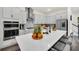 Modern kitchen with white cabinets and center island at 7401 Levee Ln, Celebration, FL 34747