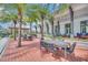 Outdoor patio with tables, chairs, and string lights at 7401 Levee Ln, Celebration, FL 34747