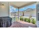 Brick patio with grill and view of community homes at 7401 Levee Ln, Celebration, FL 34747