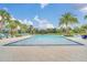 Resort-style pool with palm trees and lounge chairs at 7401 Levee Ln, Celebration, FL 34747