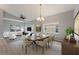 Open-concept living room and dining area with hardwood floors and plenty of light at 705 Ashton Dr, Davenport, FL 33837