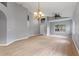 Spacious living room featuring wood floors, large windows, and an open layout at 705 Ashton Dr, Davenport, FL 33837