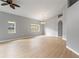 Spacious living room featuring natural lighting, neutral paint, and modern light fixture at 705 Ashton Dr, Davenport, FL 33837