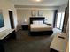 Comfortable bedroom featuring a plush bed, elegant decor, and natural light from the window at 14501 Grove Resort Ave # 1637, Winter Garden, FL 34787