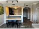Open floor plan with hardwood floors and an adjacent dining area with bench seating at 14501 Grove Resort Ave # 1637, Winter Garden, FL 34787